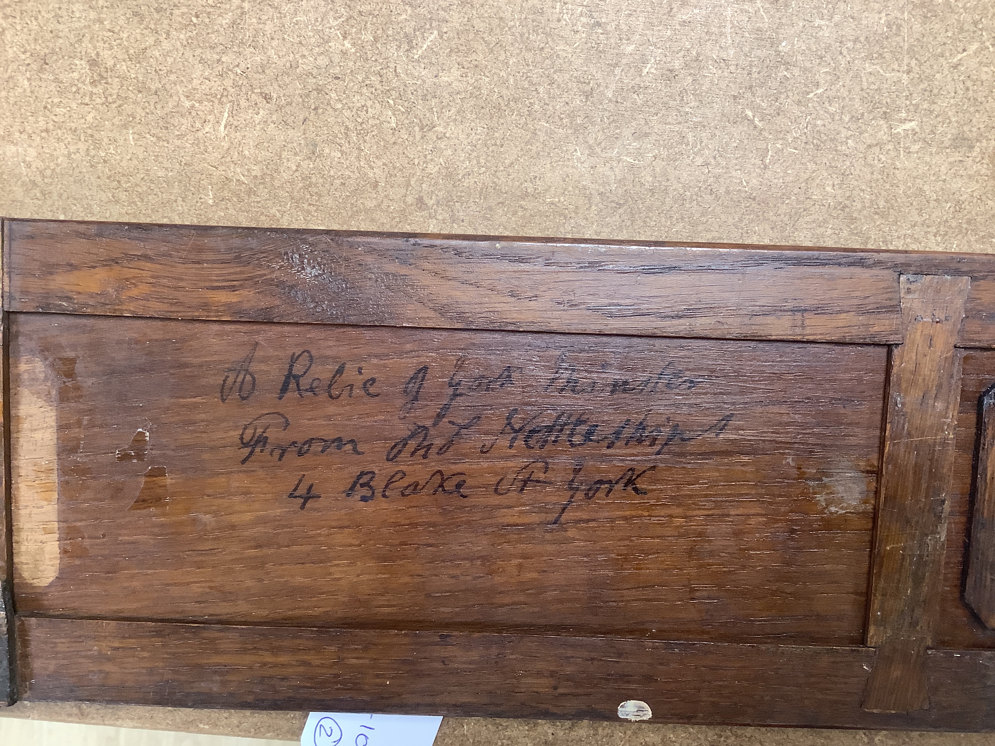 A miniature walnut chest of drawers and a bookslide, relating to the fire at York Minster, 34cm wide (closed)